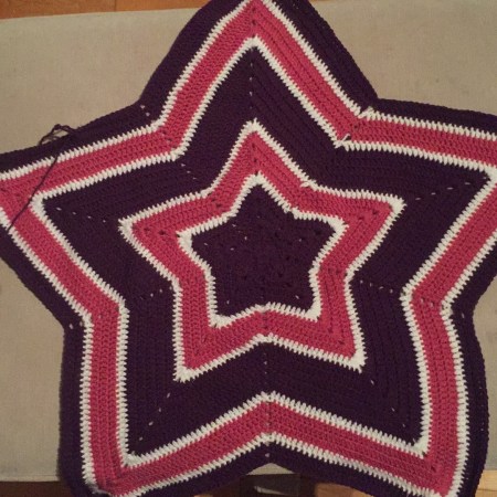 Crochet star blanket in pink, purple and white