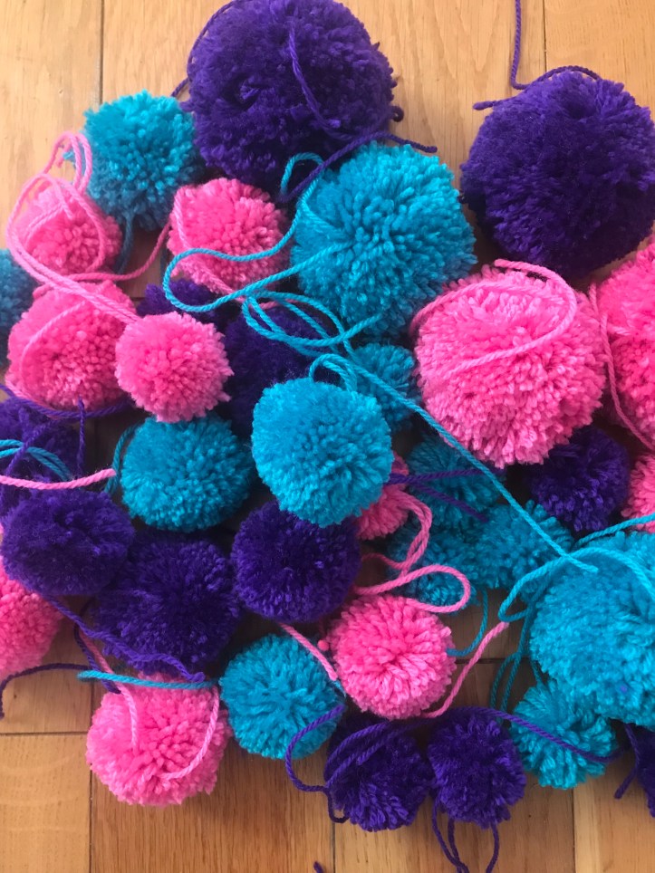 purple, blue and pink pompoms
