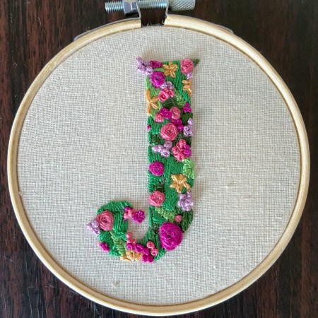 Embroidered letter J